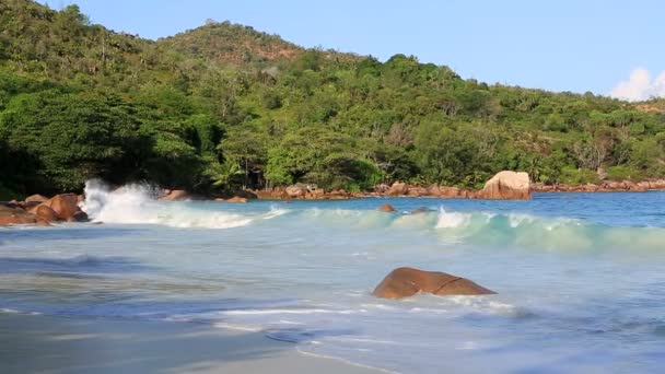 Waves at sunrise on the beach Anse Lazio. — Stock Video