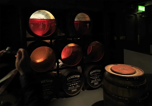 Barrels of whiskey in different colors. Old Jameson Distillery Tours — стокове фото