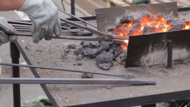 Blacksmith fire. Blacksmith working outdoors. — Stock Video