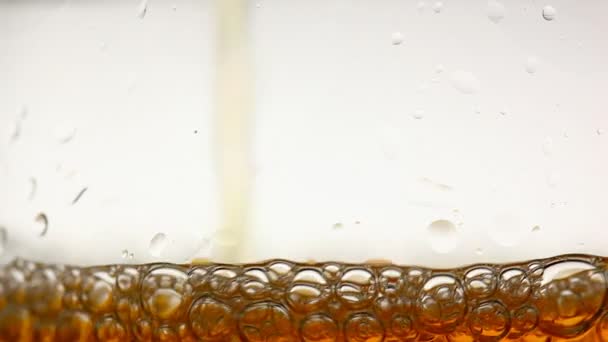 Wine poured into a clear glass — Stock Video