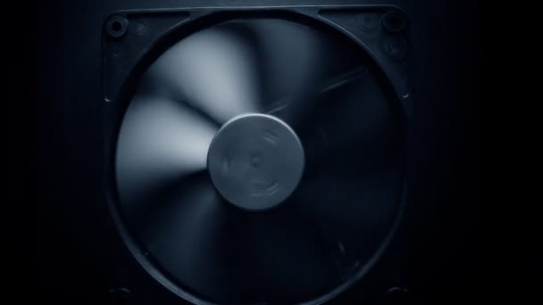 Fan turbine behind a dark surface. — Stock Video