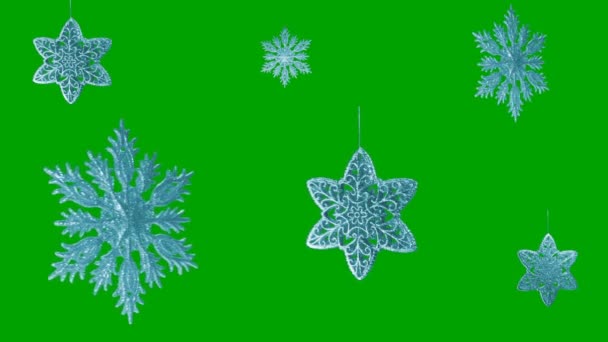 Ornamento a forma di fiocco di neve su sfondo verde . — Video Stock