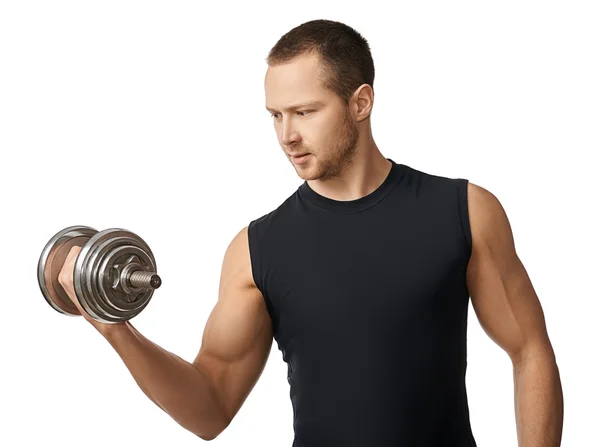 Muscular bodybuilder guy doing exercises with dumbbells — Stock Photo, Image