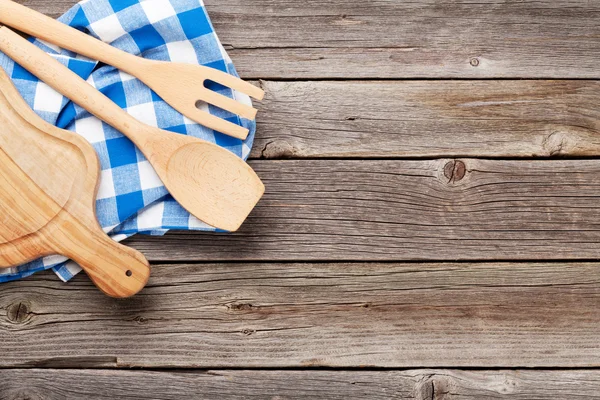 Cooking utensils on wooden table — Stock Photo, Image