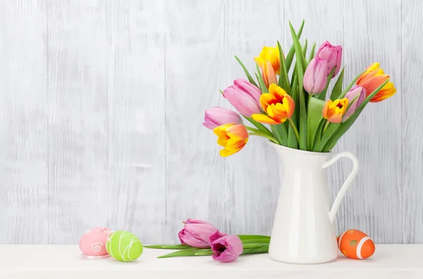 Easter eggs and colorful tulips — Stock Photo, Image