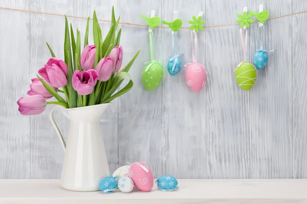 Easter eggs and pink tulips — Stock Photo, Image