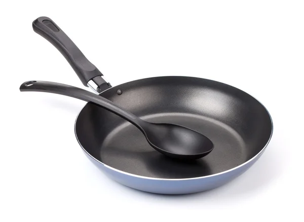 Frying pan with spoon — Stock Photo, Image