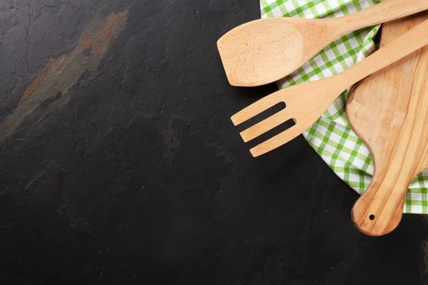 Cooking utensils on stone table — Stock Photo, Image