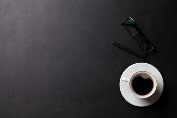 Desk with coffee cup, pen — Stock Photo, Image