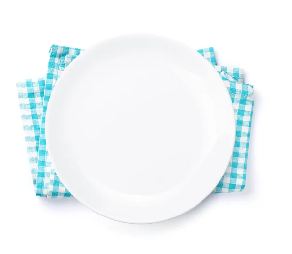 Empty plate over kitchen towel — Stock Photo, Image