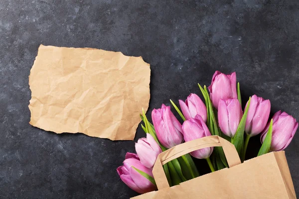 Fresh purple tulip flowers bag — Stock Photo, Image