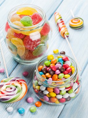 Colorful candies on wooden   clipart
