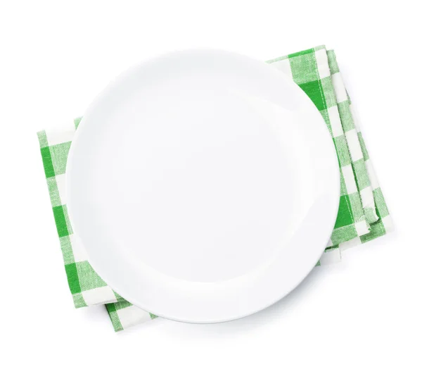 Пустая тарелка над кухонным полотенцем — стоковое фото