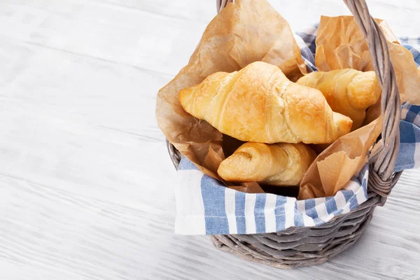 Fresh croissants basket — Stock Photo, Image