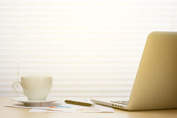 Office workplace with laptop and coffee — Stock Photo, Image