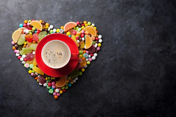 Candies, jelly and marmalade heart and coffee — Stock Photo, Image