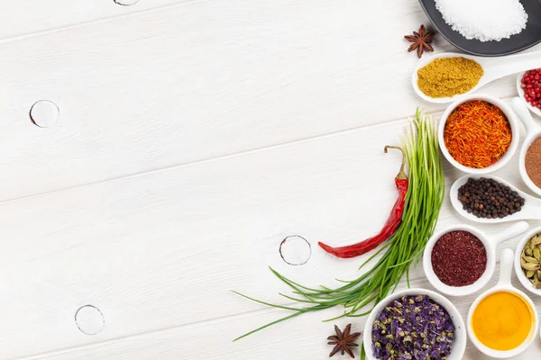 Various spices on white wooden background — Stock Photo, Image