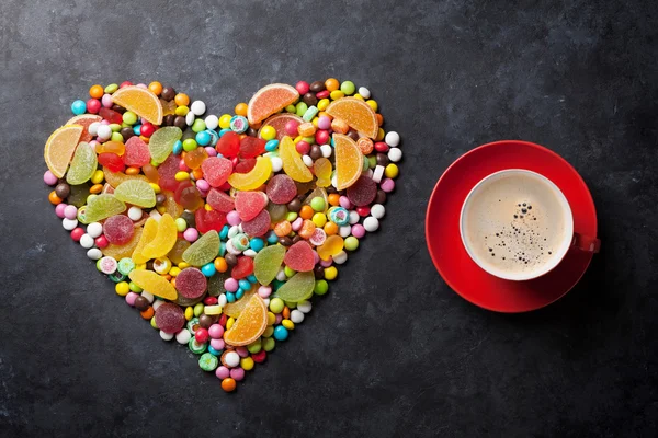 Candies, jelly and marmalade heart and coffee — Stock Photo, Image