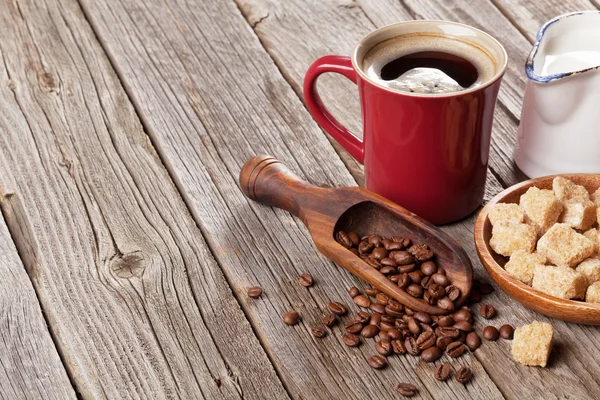 Coffee cup, beans and brown sugar — Stock Photo, Image