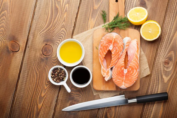 Salmon, spices and condiments — Stock Photo, Image