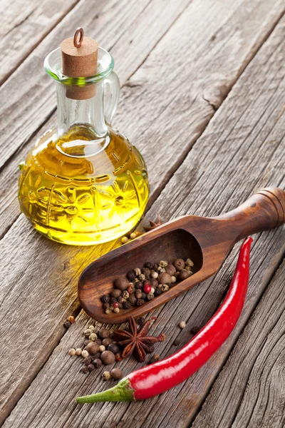 Spices and condiments on wooden table — Stock Photo, Image