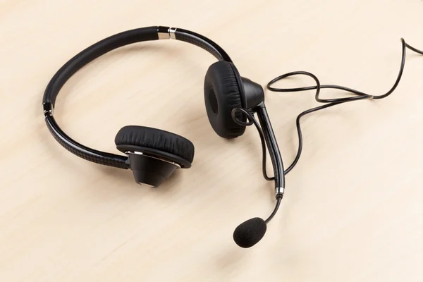 Office desk with headset — Stock Photo, Image