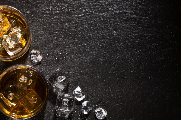 Glasses of whiskey with ice 