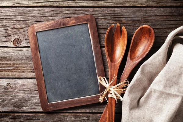 Blackboard and cooking utensils — Stock Photo, Image