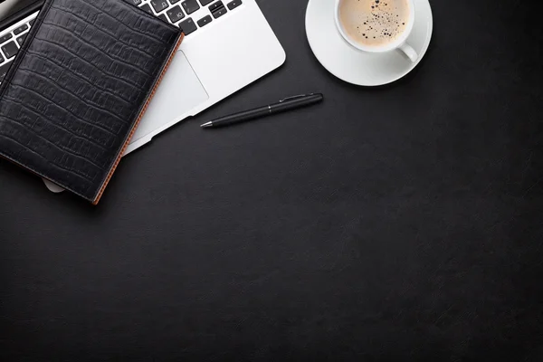 Office desk with laptop, coffee, notepad — Stock Photo, Image