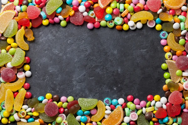 Bonbons, Gelee und Marmelade über Stein — Stockfoto