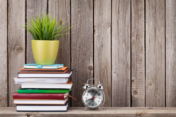 Wooden shelf with books and supplies — Stock Photo, Image