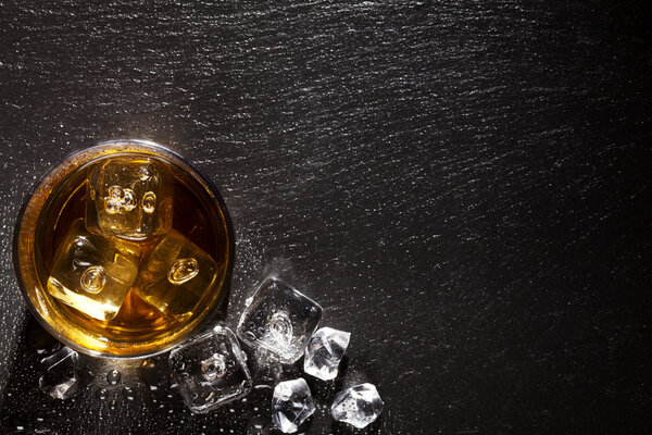 Glass of whiskey with ice 