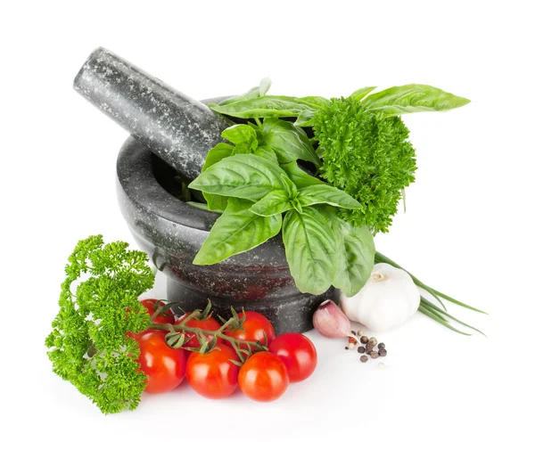 Herbs and spices in mortar — Stock Photo, Image