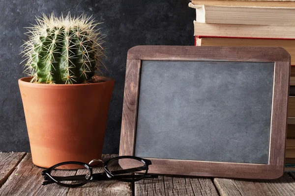 Books, cactus and chalk board — Stock Photo, Image