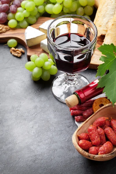 Wine, grapes, cheese, sausages