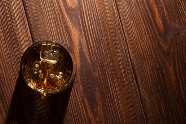 Glass of whiskey with ice — Stock Photo, Image