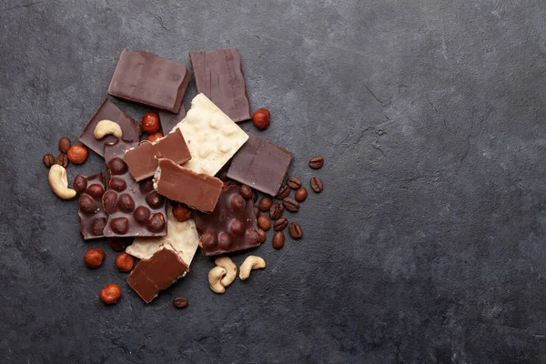 Various Chocolate Pieces Coffee Beans Nuts Stone Table Top View — Stock Photo, Image