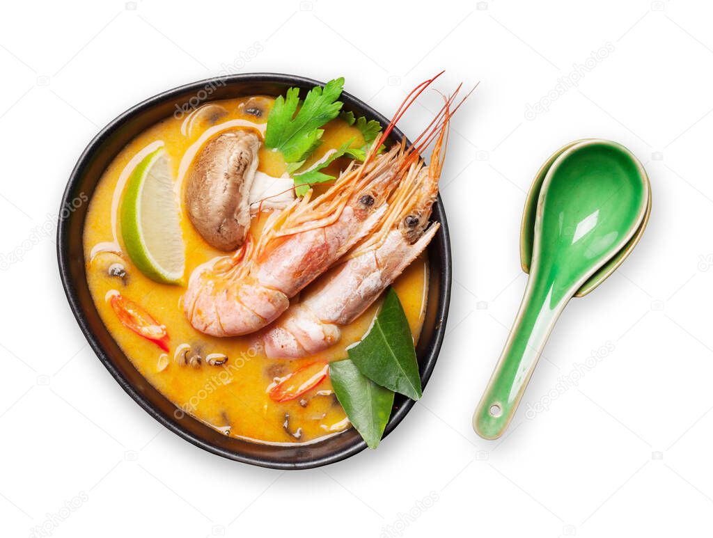 Tom yum traditional thai soup with seafood, mushrooms, coconut milk and hot spices. Isolated on white background. Top view flat lay