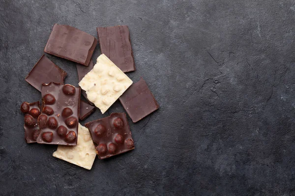 Various Chocolate Pieces Stone Table Top View Flat Lay Copy — Stock Photo, Image