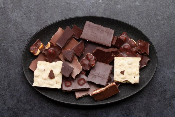 Various Chocolate Pieces Stone Table Top View Flat Lay — Stock Photo, Image