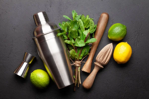 Mojito cocktail making. Ingredients and drink utensils. Top view flat lay