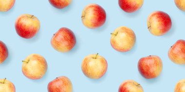 Kırmızı elma meyveleri mavi arkaplansız arkaplan dokusunda. Düz arkaplan