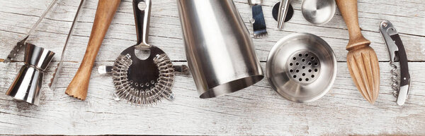 Cocktail utensils. Set of bar tools on wooden table. Top view flat lay
