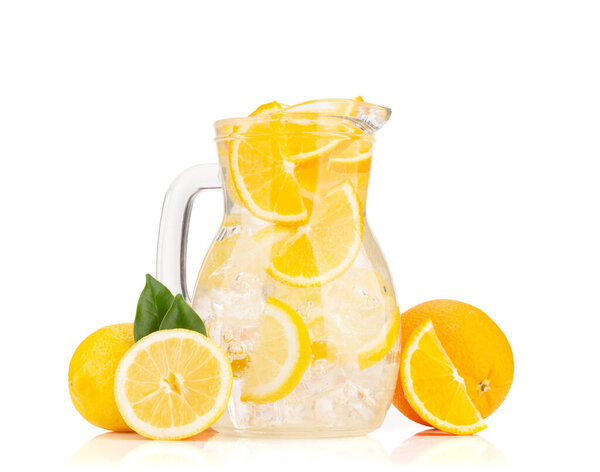 Fresh lemonade glass pitcher with ripe citrus fruits. Isolated on white background