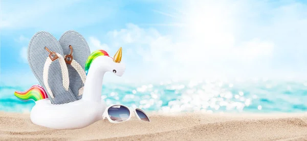 Summer Sea Sparkling Waves Inflatable Unicorn Sunglasses Flip Flops Sand — Stock Photo, Image