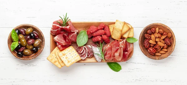 Antipasto Board Prosciutto Salami Crackers Cheese Nuts Olives Top View — Stock Photo, Image