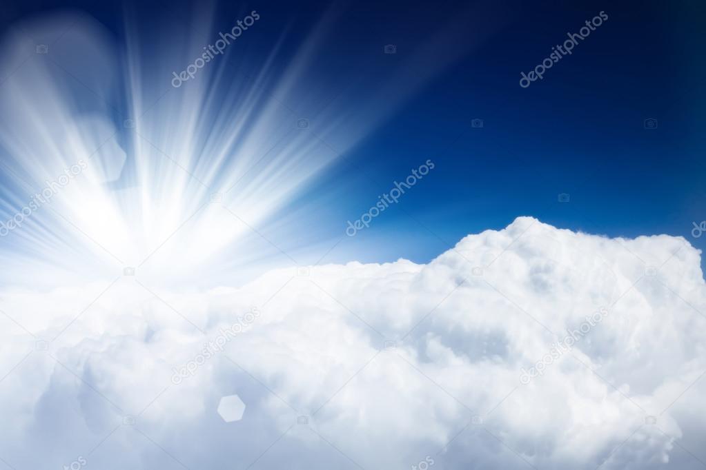 Blue sky with clouds and sun