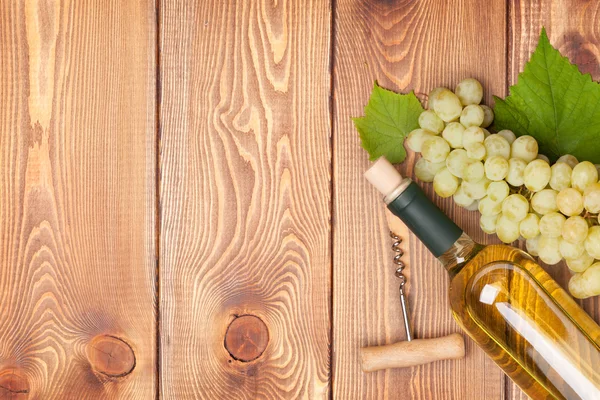 White wine bottle and rape — Stock Photo, Image