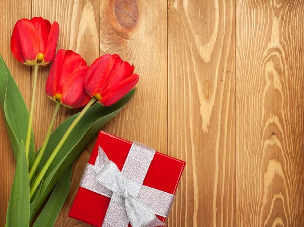 Fresh tulips and gift box — Stock Photo, Image