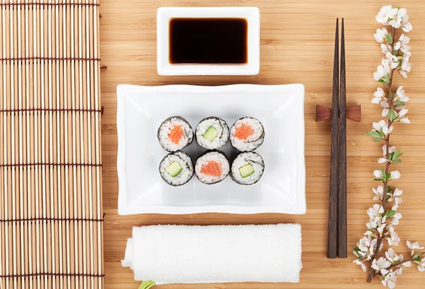 Sushi maki set with sakura branch — Stock Photo, Image